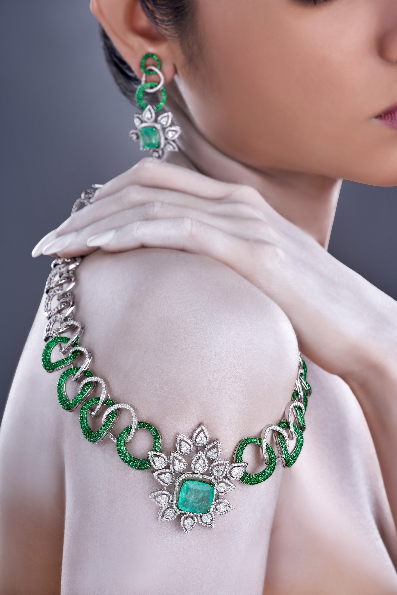 Emerald and diamond necklace worn in an editorial portrait